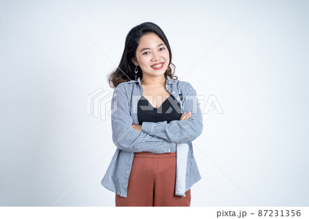 young asian woman stand with crossed hands young asian woman stand with crossed hands 87231356