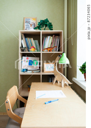 desk with sheet of paper with math test in the children room. desk with sheet of paper with math test in the children room. 87234065
