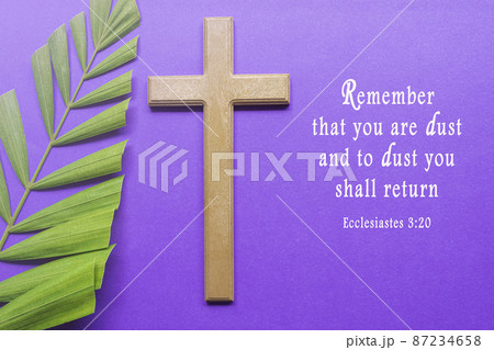 Ash Wednesday Bible Verse. Cross and palm leaves on purple background. 87234658