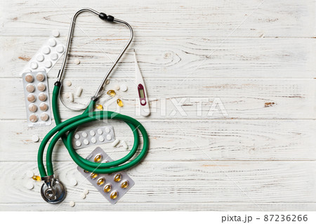 Medical background. Many different various medicine tablets or pills on the table with stethoscope. Close up. Healthcare pharmacy and medicine concept 87236266