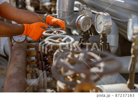 Industrial worker on his job at construction plant 87237163