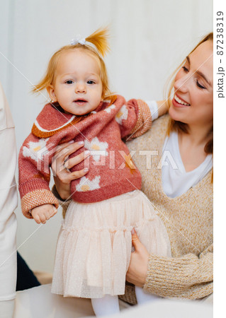 Cute mom and baby daughter play and hug. games with children.  87238319