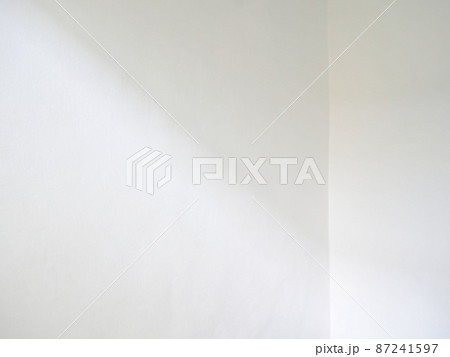 Window shadow and light blur abstract background on white wall Window shadow and light blur abstract background on white wall 87241597