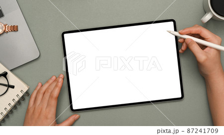 Female hand using stylus pen drawing on digital tablet Female hand using stylus pen drawing on digital tablet 87241709