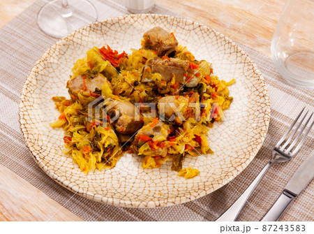 Plate of braised sauerkraut with fried pork meat 87243583