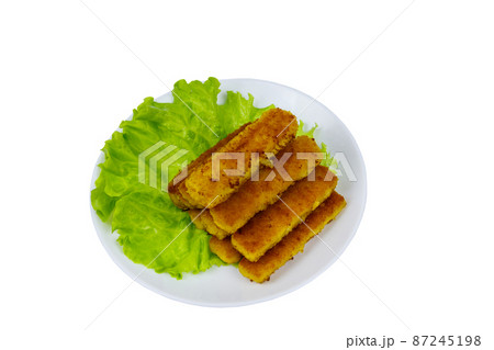 Fried fish fingers on a plate with lettuce isolated on white background Fried fish fingers on a plate with lettuce isolated on white background 87245198
