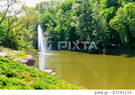 View of a lake with Snake Fountain in Sofiyivka park in Uman, Ukraine 87245214