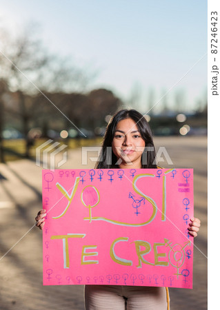 8 march feminism movement. Ecuadorian young woman with a Spanish banner. yo si te creo 87246423