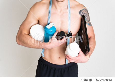 Fitness protein jars white on white background bodybuilder powder strong high ache injury, backache spine male stress, hand expression. therapy, back suffer attractive 87247048