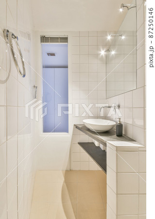 Luxury interior design of a bathroom with marble walls 87250146