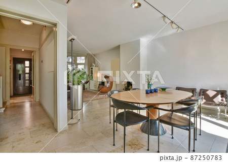 dining area with large table and leather chairs dining area with large table and leather chairs 87250783