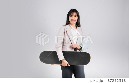Woman smile broken arm after accident wear arm splint for treatment she play skateboard skating accident sport extreme Woman smile broken arm after accident wear arm splint for treatment she play skateboard skating accident sport extreme 87252518
