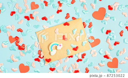 Envelope with a rainbow on Blue background with hearts. Different love concept 87253022