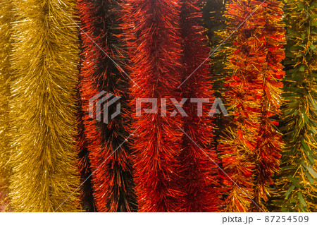 Christmas bright colored tinsel decor and christmas background decorations Christmas bright colored tinsel decor and christmas background decorations 87254509