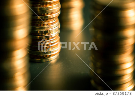 Pile of gold coins money stack in finance treasury deposit bank account saving 87259178