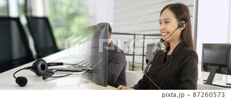 Business people wearing headset working in office broaden view 87260573