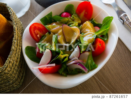 Dietary salad with tomatoes, greens 87261657
