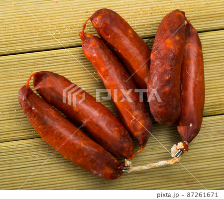 Chorizo on wooden surface 87261671
