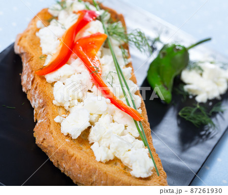 Toast with soft cheese and bell pepper Toast with soft cheese and bell pepper 87261930