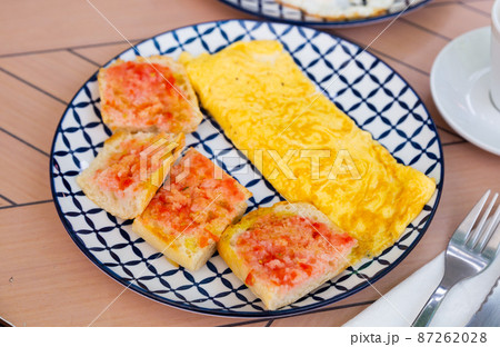 Stuffed french omelet with fresh baguette and sauce Stuffed french omelet with fresh baguette and sauce 87262028