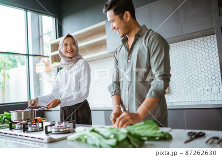 romantic young muslim couple have fun making food at home 87262630