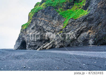 View of Renisdrangar basalt sea stacks at Reynisfjall mountain. View of Renisdrangar basalt sea stacks at Reynisfjall mountain. 87263493