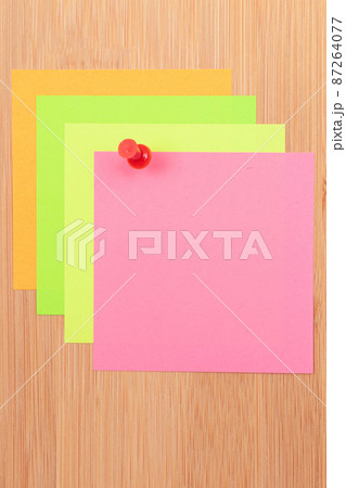 Colored Sticky Notes Pinned to the Wooden Message Board 87264077