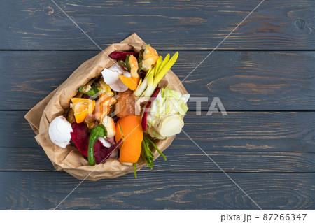 Vegetable and fruit waste from cooking, collected in a garbage bag for recycling. Compost. The concept of zero waste. 87266347