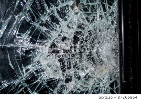 War bullet broken glass window on black 87266864
