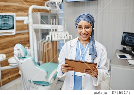 Young Female Dentist in Office 87269175
