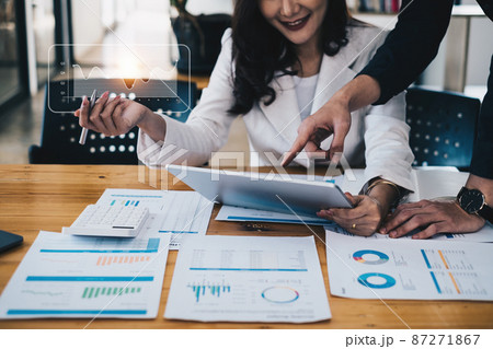 Group of IT consultant working by digital tablet and management big data and analyze financial document of company. Group of IT consultant working by digital tablet and management big data and analyze financial document of company. 87271867