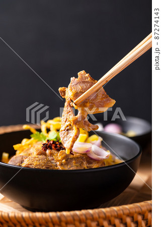 Northern Thai food (Khao Soi), Spicy curry noodles soup with coconut milk and beef, Local Thai food 87274143