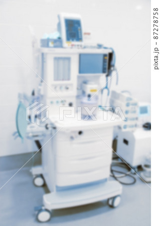 Abstract blur of hospital and clinic interior. Modern equipment in operating room. Medical devices for neurosurgery. Surgery instruments and surgical procedures. Background with blue filter. Abstract blur of hospital and clinic interior. Modern equipment in operating room. Medical devices for neurosurgery. Surgery instruments and surgical procedures. Background with blue filter. 87278758