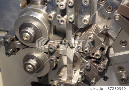 Blurred picture of small spring making machine 87280349