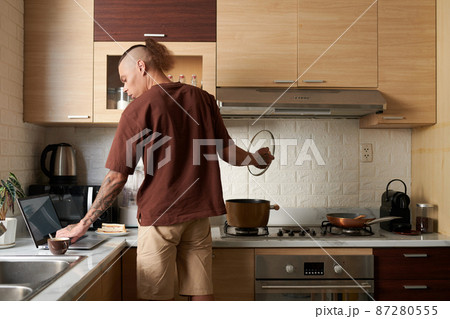 Man Cooking and Working Man Cooking and Working 87280555