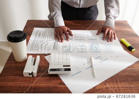 Project Manager Checking Mockups 87281636