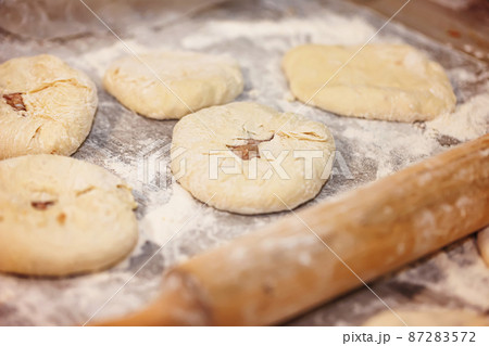 Preparation of a traditional Caucasian dish with meat - bilyash Preparation of a traditional Caucasian dish with meat - bilyash 87283572