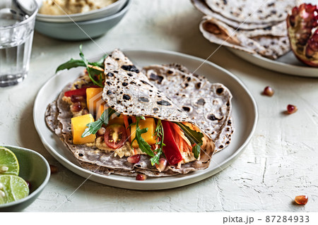Mango Rocket and Pomegranate in Sweet Purple Potato Tortilla 87284933