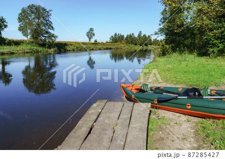 Canoeing trip on the river. Rafting in kayaks. Active recreation on the water. Canoeing trip on the river. Rafting in kayaks. Active recreation on the water. 87285427
