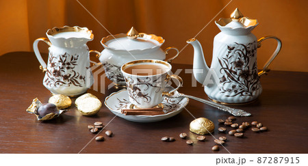 Sweets on the background of coffee still life Sweets on the background of coffee still life 87287915