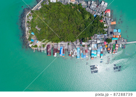 Aerial view top down of small island in tropical sea with small bridge to the island located koh rat suratthani Thailand Aerial view top down of small island in tropical sea with small bridge to the island located koh rat suratthani Thailand 87288739