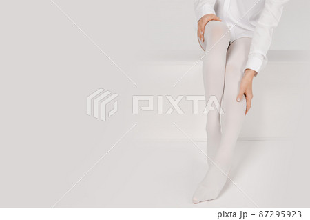 Anti-embolic Compression Hosiery for surgery isolated on white. Medical white stockings, tights for varicose veins and venouse therapy. Thrombo embolic deterrent hose or anti-embolism stockings. Anti-embolic Compression Hosiery for surgery isolated on white. Medical white stockings, tights for varicose veins and venouse therapy. Thrombo embolic deterrent hose or anti-embolism stockings. 87295923