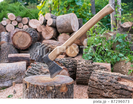 Photography on theme big steel axe with wooden handle Photography on theme big steel axe with wooden handle 87296073