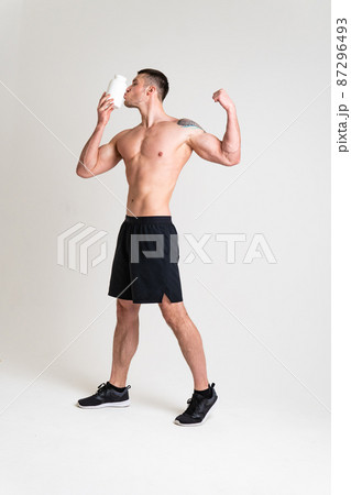 Fitness protein jars white on white background bodybuilder powder strong high ache hurt injury, backache person male health medical, muscular holding. Touching lumbar disease suffer attractive 87296493