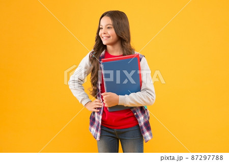 Education comes first. Happy child hold study books. Basic education. Back to school. Education comes first. Happy child hold study books. Basic education. Back to school. 87297788