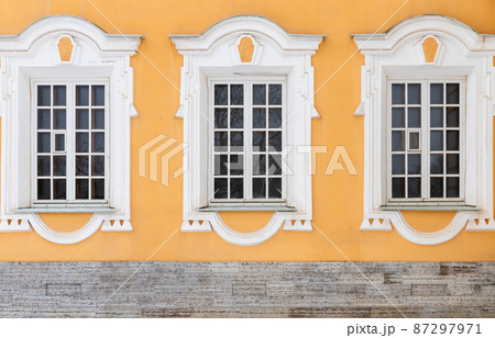 Classical architecture details, windows with white frames Classical architecture details, windows with white frames 87297971