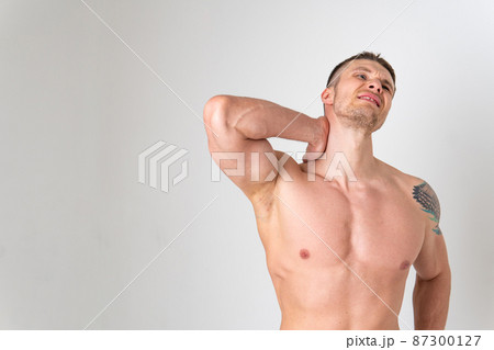 The muscles of the neck in a man on a white background are hurt pain body cramp person isolated health medical, chronic. lumbar therapy, problem suffer attractive The muscles of the neck in a man on a white background are hurt pain body cramp person isolated health medical, chronic. lumbar therapy, problem suffer attractive 87300127