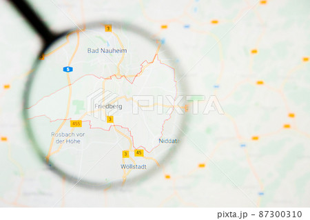 Friedberg city in Germany, Bavaria visualization illustrative concept on display screen through magnifying glass 87300310