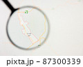 Al-Ula city in Saudi Arabia visualization illustrative concept on display screen through magnifying glass 87300339