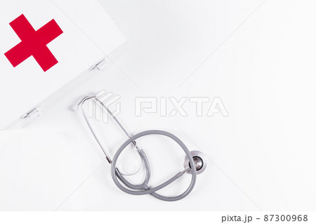 first aid kit with stethoscope white background 87300968